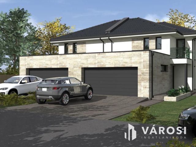 Tágas ,napfényes ikerház családbarát környéken eladó